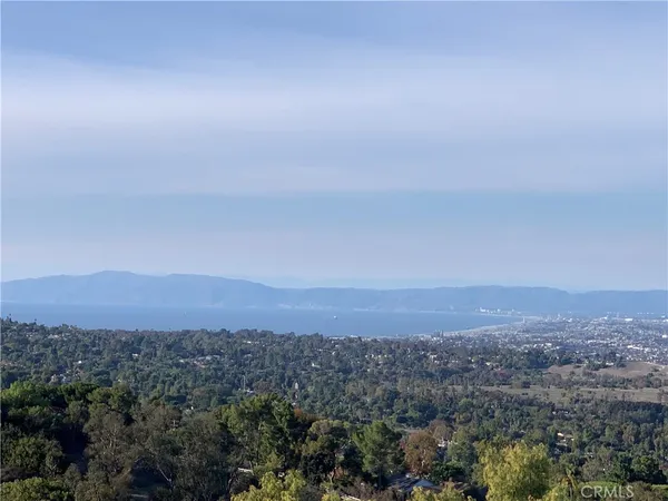 an aerial view of residential house and green space