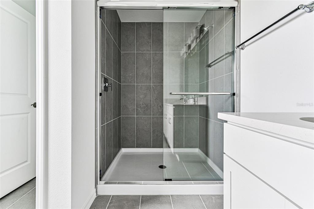 9106 Optimist Way Palmetto, FL 34221 - Photo 15 of 28 a bathroom with a shower and a sink