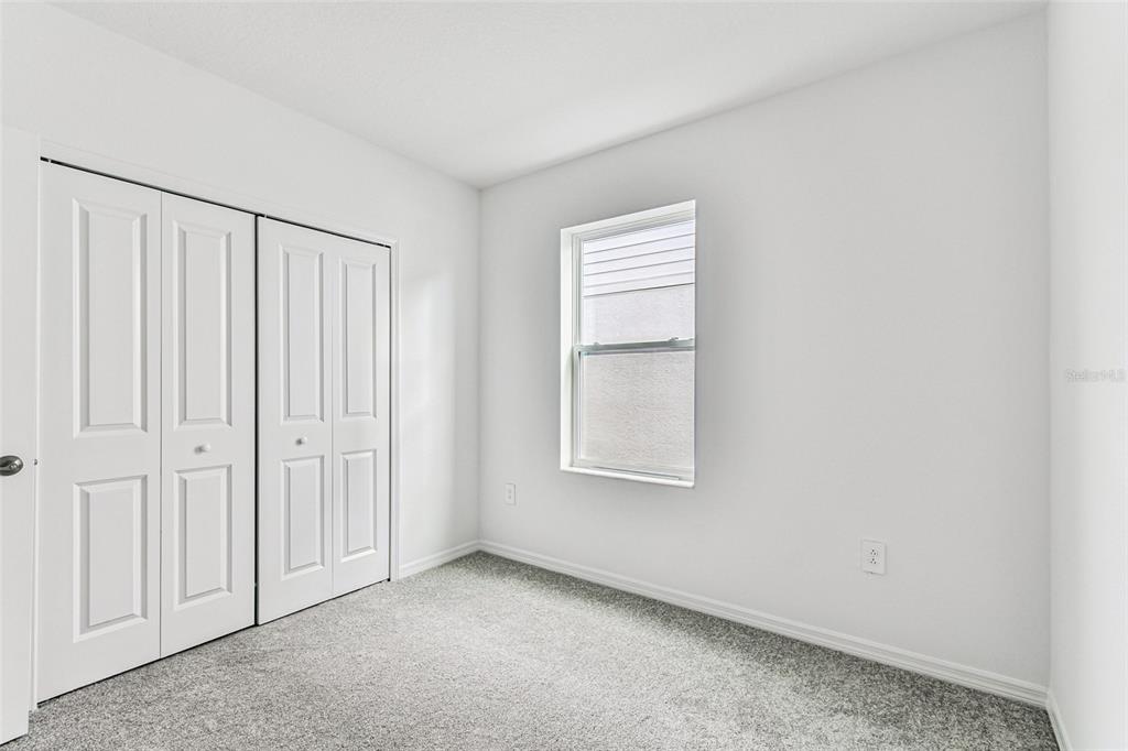 9106 Optimist Way Palmetto, FL 34221 - Photo 16 of 28 an empty room with windows