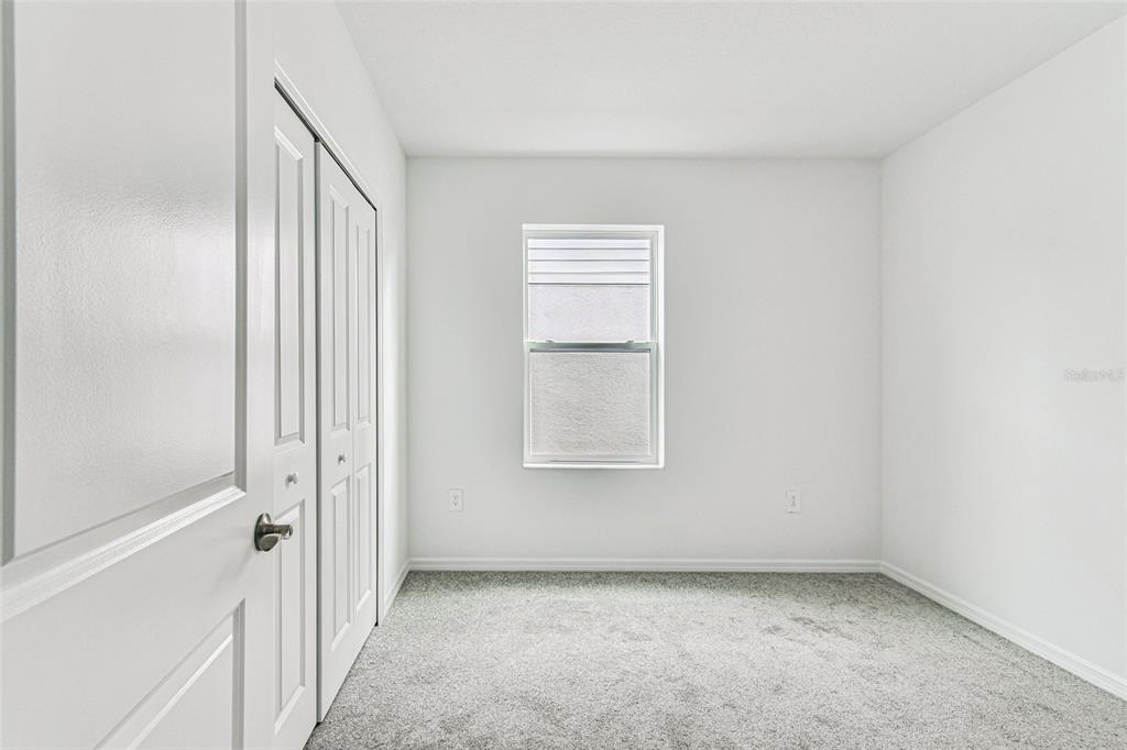 9106 Optimist Way Palmetto, FL 34221 - Photo 17 of 28 an empty room with a bench