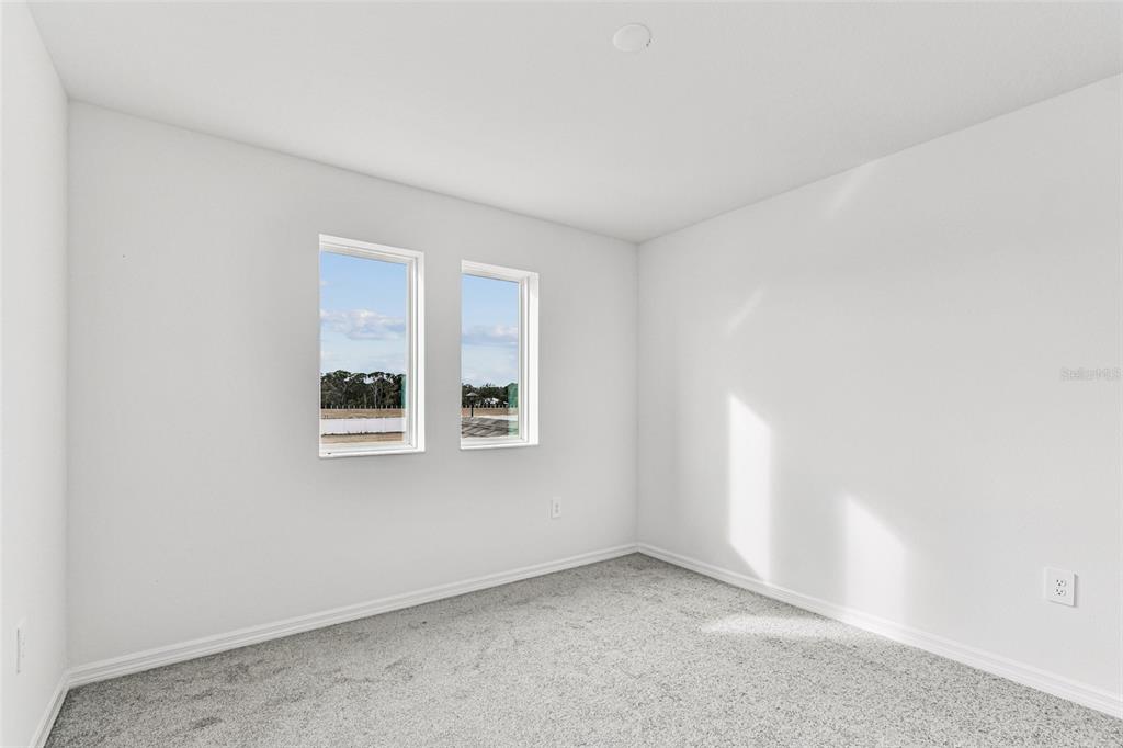 9106 Optimist Way Palmetto, FL 34221 - Photo 20 of 28 an empty room with windows