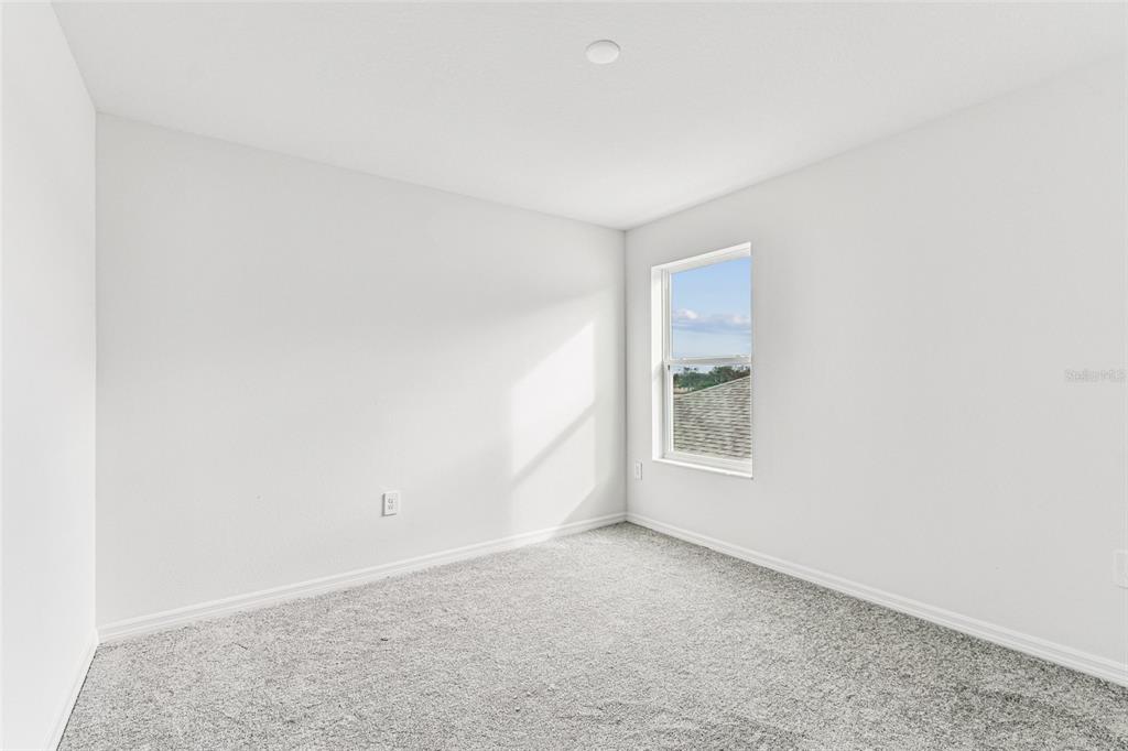 9106 Optimist Way Palmetto, FL 34221 - Photo 25 of 28 a view of an empty room with a window