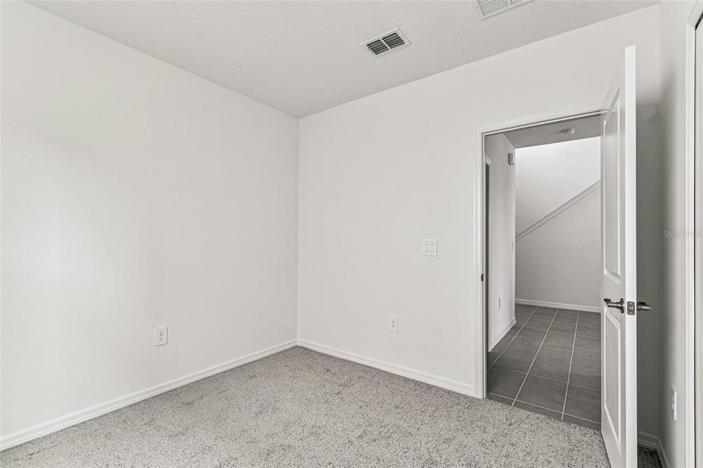 9106 Optimist Way Palmetto, FL 34221 - Photo 28 of 28 an empty room with an entryway