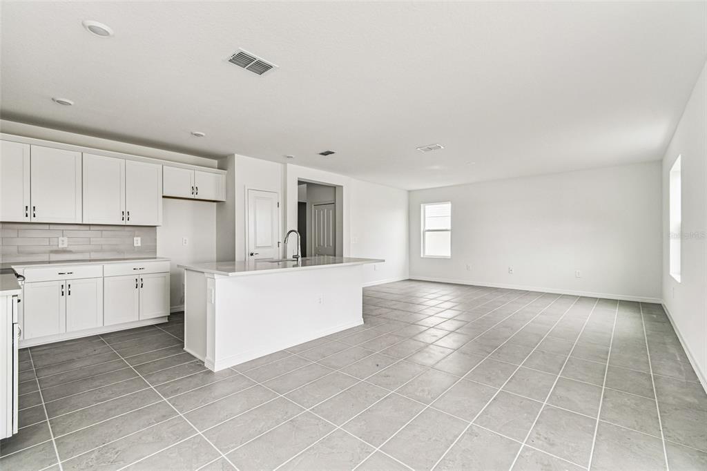 9106 Optimist Way Palmetto, FL 34221 - Photo 8 of 28 a view of a kitchen with microwave and cabinets