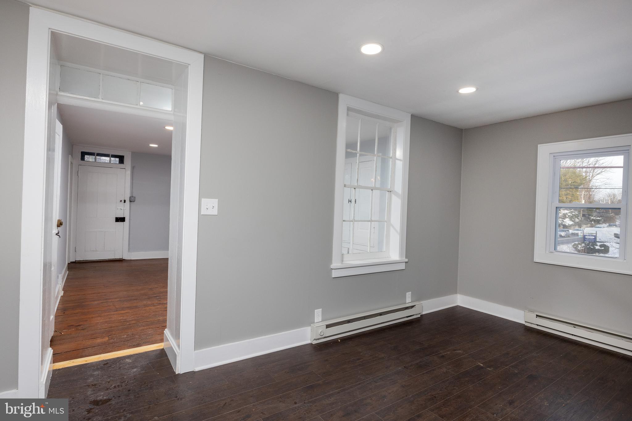 6192 Lower York Road, Unit B New Hope, PA 18938 - Photo 4 of 10 an empty room with wooden floor and windows