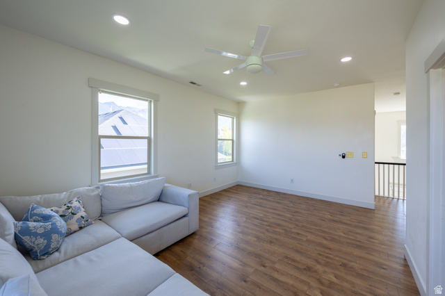 868 Braddock Lane Alpine, UT 84004 - Photo 30 of 64 Spacious room featuring wood-finish flooring, ample natural light from multiple windows, a ceiling fan, and recessed lighting