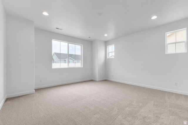 1869 South 2425 West Ogden, UT 84401 - Photo 19 of 22 Unfurnished room with light carpet and recessed lighting