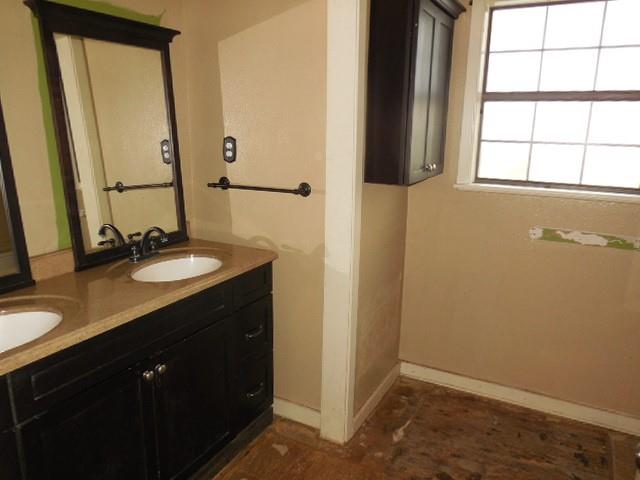 1104 Foreman Road Doyline, LA 71023 - Photo 9 of 11 a bathroom with a sink vanity and a mirror