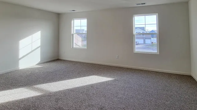 an empty room with windows