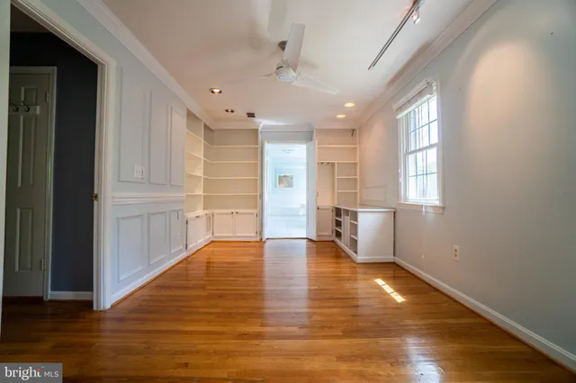 a view of a room with racks on the wall