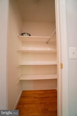 a view of a livingroom with a ceiling fan and window