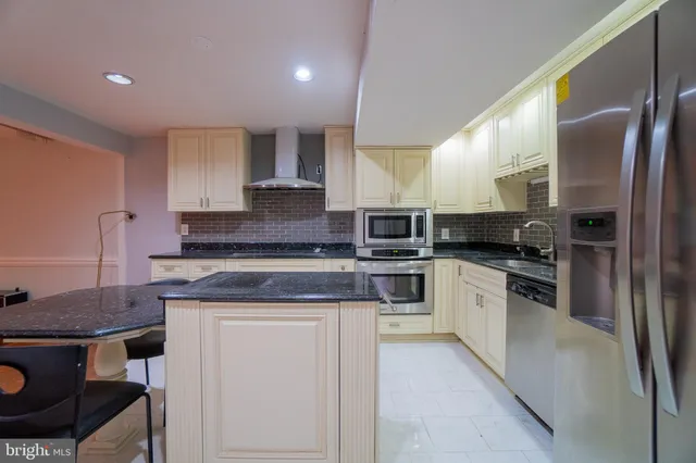 a view of a room with pool table and chairs