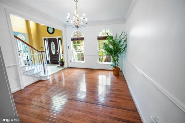 a kitchen with granite countertop wooden cabinets a sink and a window
