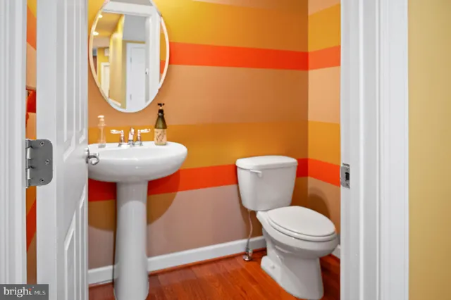 a living room with furniture a fireplace and a large window