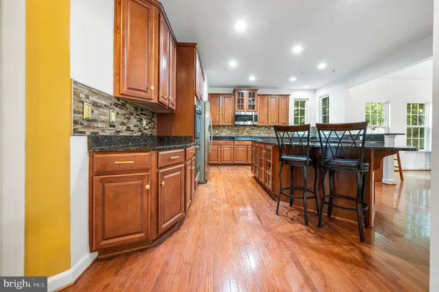 a view of an entryway with wooden floor