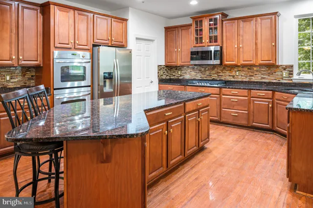 a view of staircase with railing and a floor to ceiling window