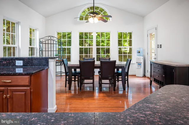 an empty room with wooden floor and closet
