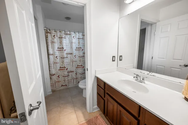 a view of path along with retail shop and outdoor seating