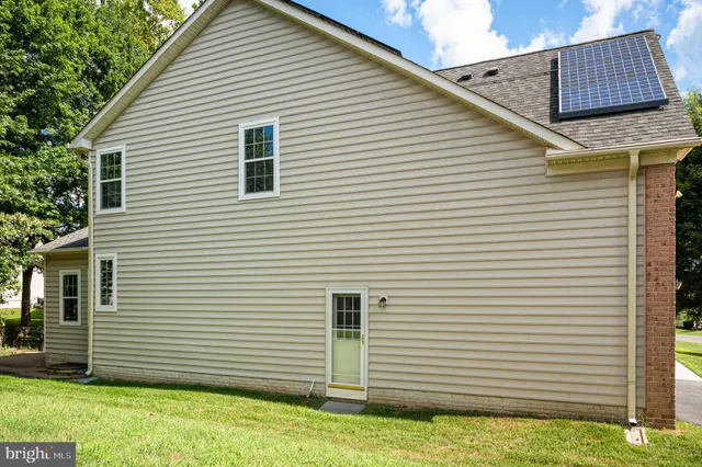 a hallway with painted walls and a large window