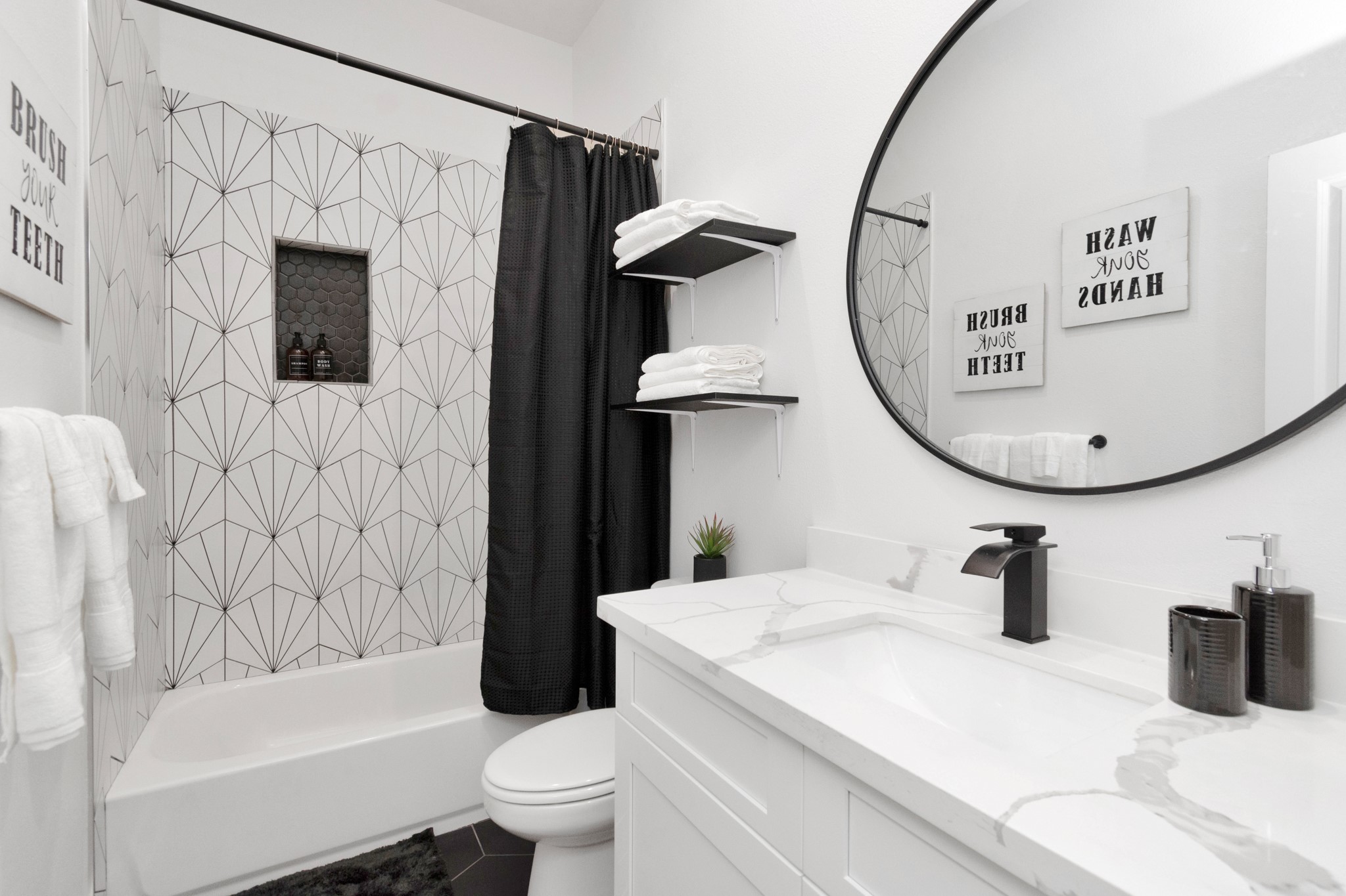 5308 Denmark Street Houston, TX 77028 - Photo 31 of 36 a bathroom with a sink a toilet and a mirror
