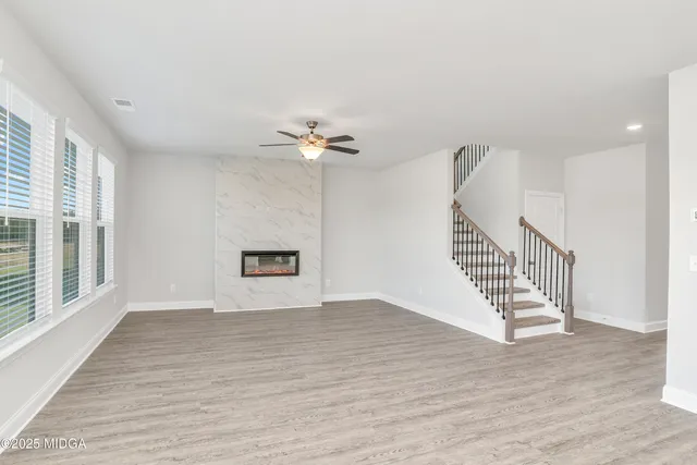 a view of an entryway with wooden floor