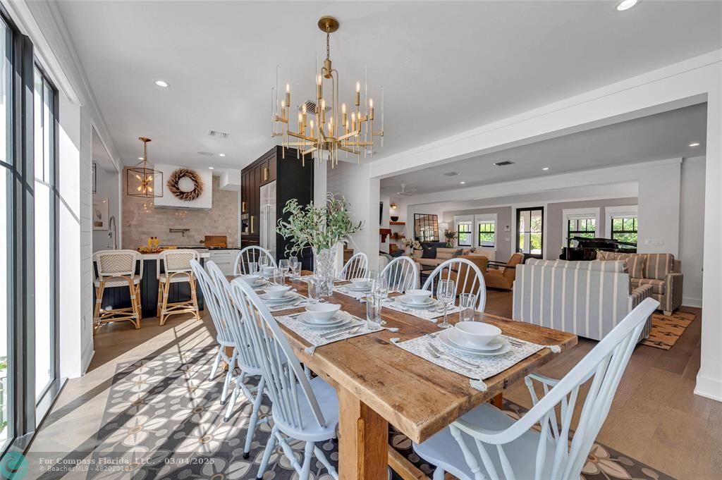 450 North Swinton Avenue Delray Beach, FL 33444 - Photo 13 of 43 a view of a dining room with furniture window and wooden floor