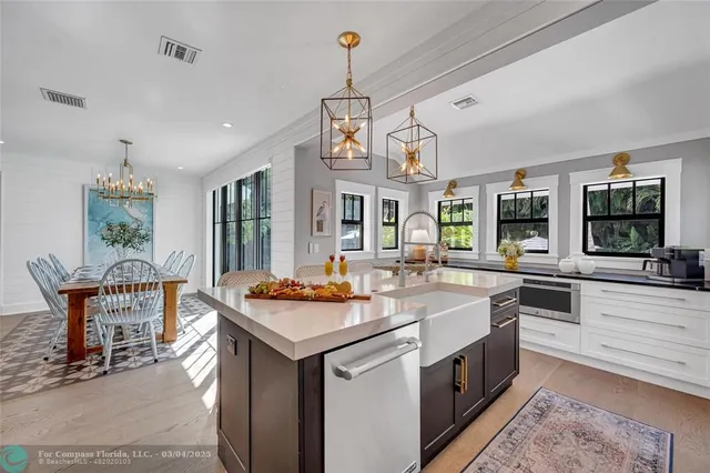 a kitchen with a table and chairs in it