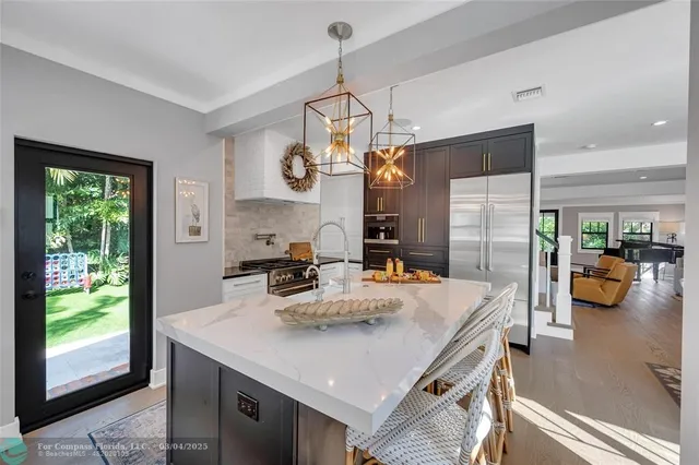 a kitchen with a sink and large window