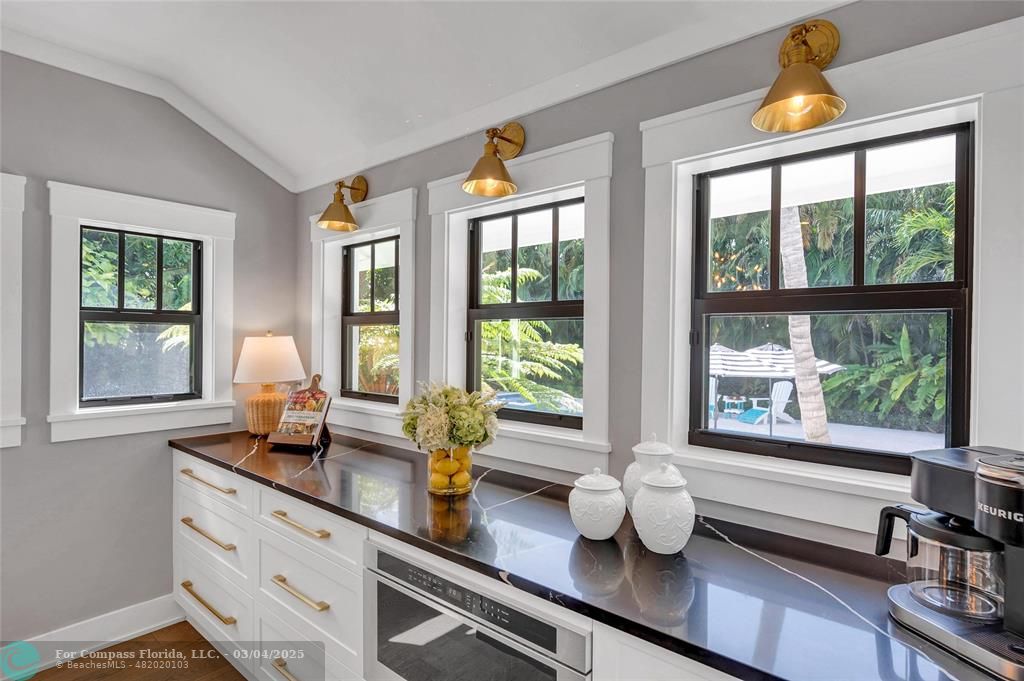 450 North Swinton Avenue Delray Beach, FL 33444 - Photo 19 of 43 a kitchen with a sink and large window