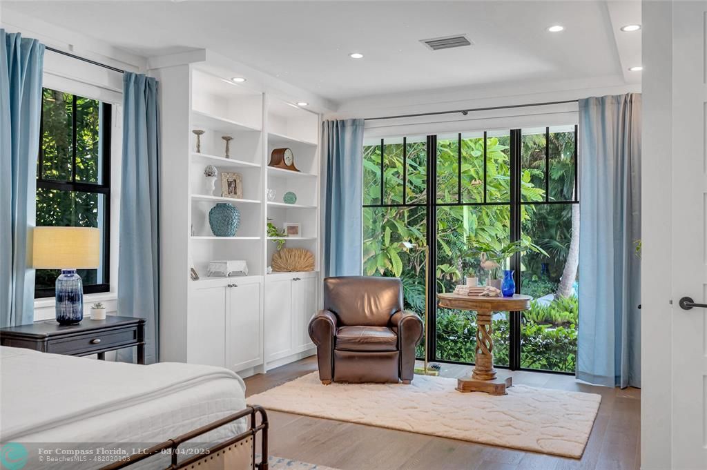 450 North Swinton Avenue Delray Beach, FL 33444 - Photo 25 of 43 a living room with furniture and a large window