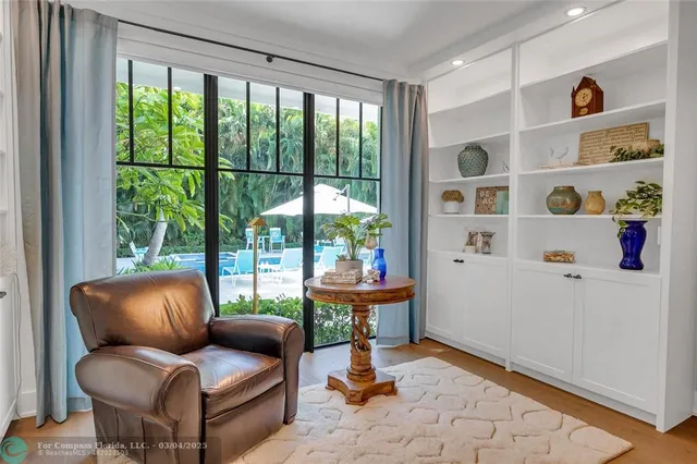 a living room with kitchen island granite countertop furniture and a fireplace