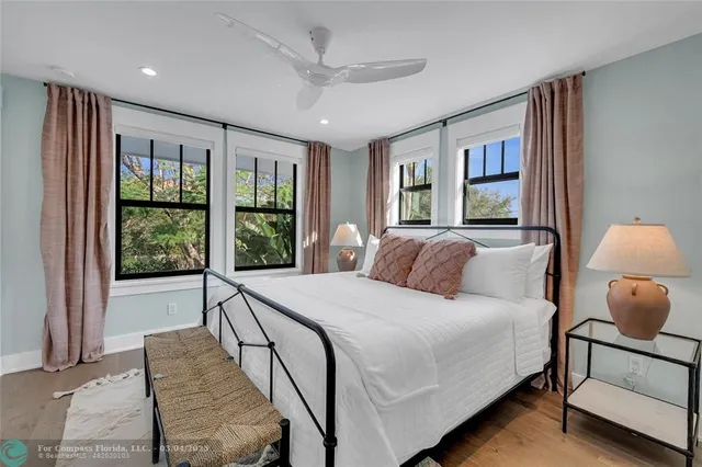 a bedroom with a large bed and a window