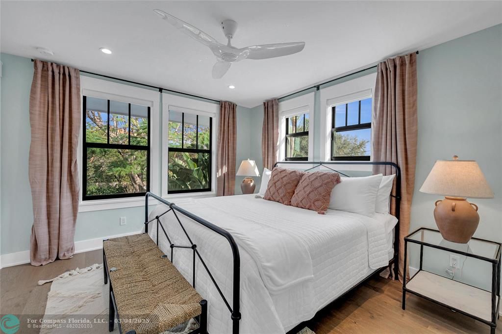 450 North Swinton Avenue Delray Beach, FL 33444 - Photo 34 of 43 a bedroom with a bed and a large window