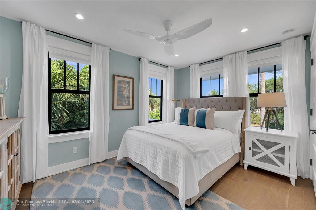 450 North Swinton Avenue Delray Beach, FL 33444 - Photo 36 of 43 a bedroom with a large bed and a window