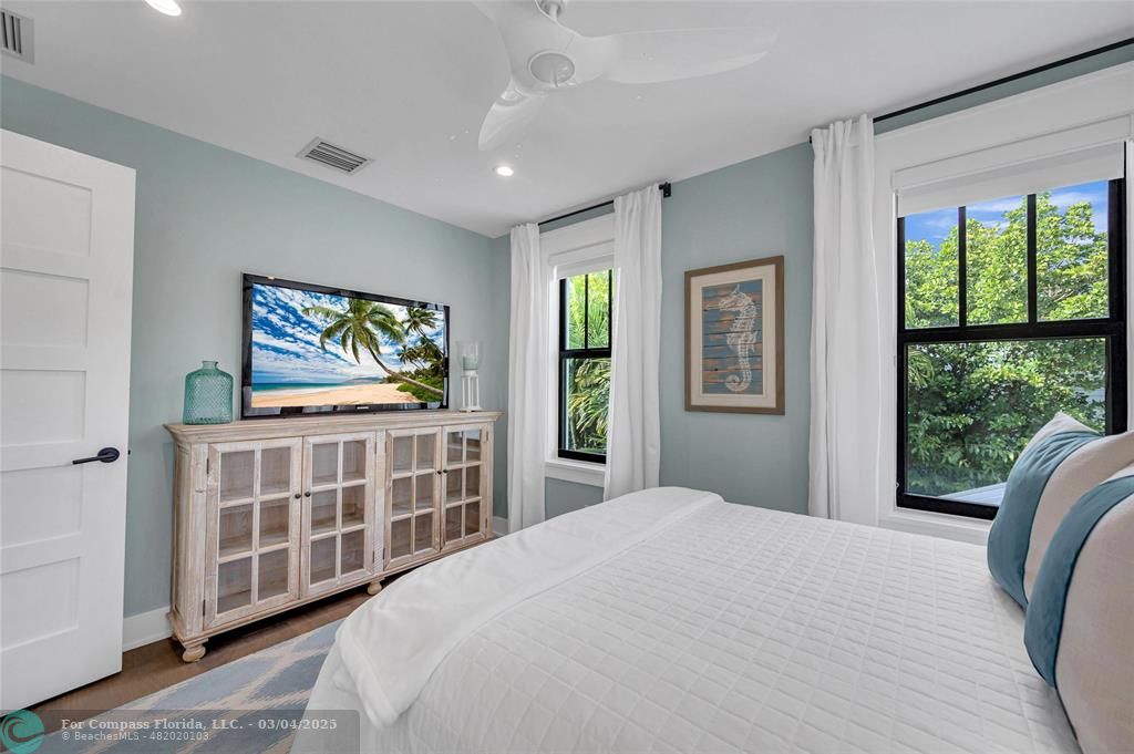 450 North Swinton Avenue Delray Beach, FL 33444 - Photo 37 of 43 a bedroom with a bed and a flat screen tv