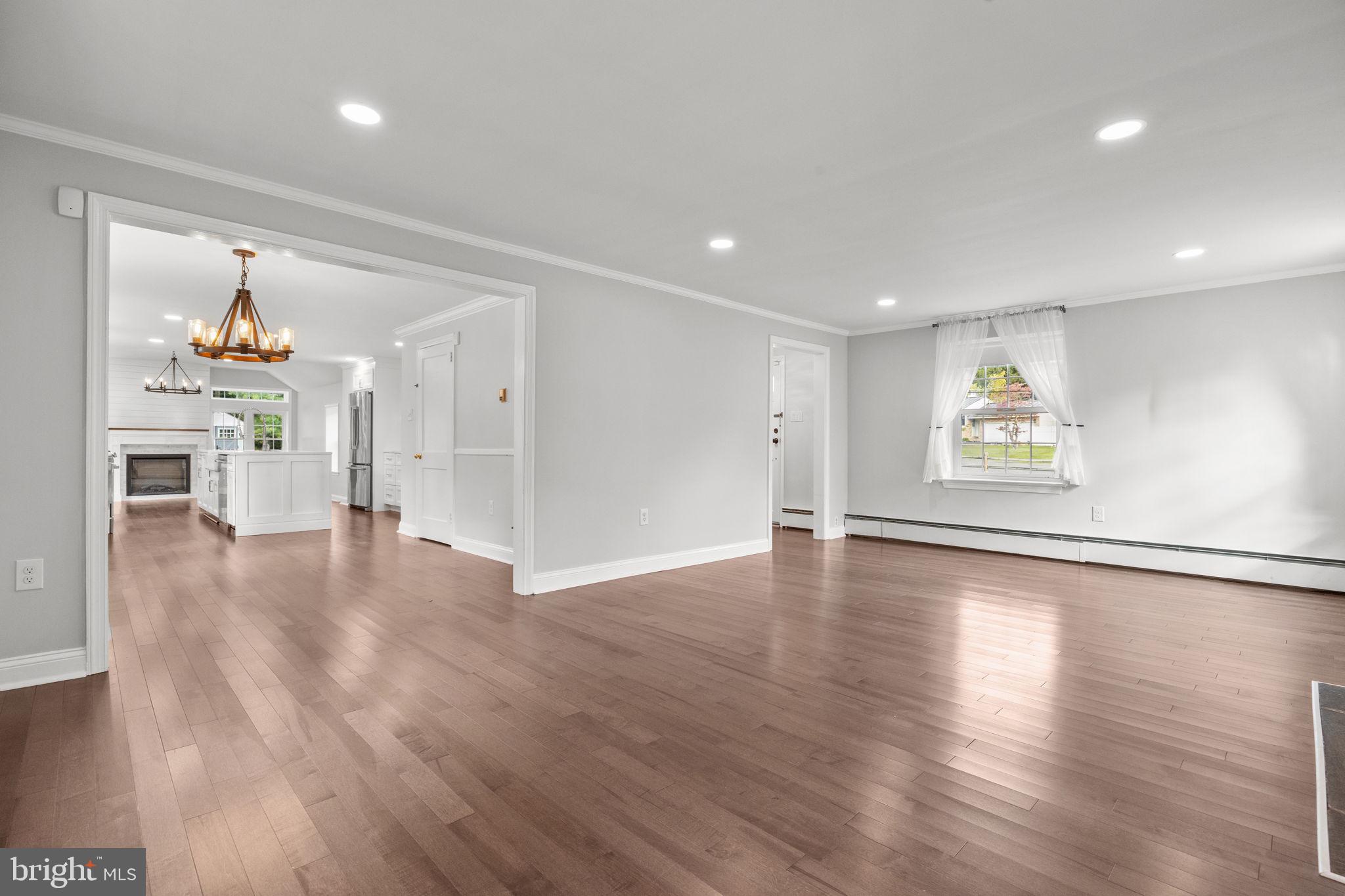 1434 Holcomb Road Huntingdon Valley, PA 19006 - Photo 11 of 49 a view of an empty room with window and wooden floor