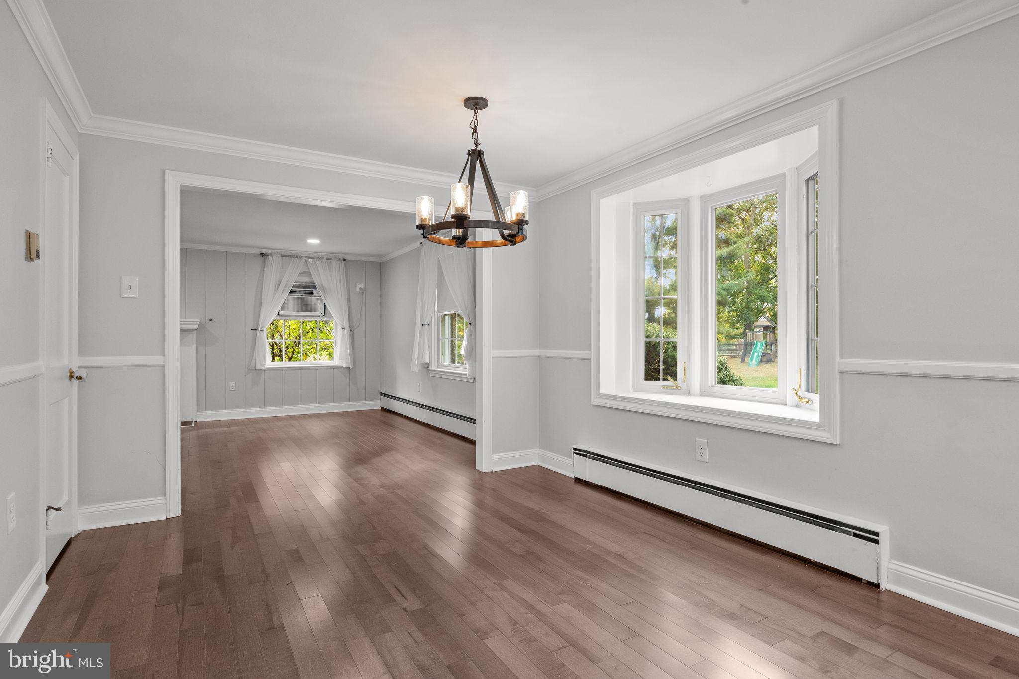 1434 Holcomb Road Huntingdon Valley, PA 19006 - Photo 12 of 49 wooden floor in an empty room with a window