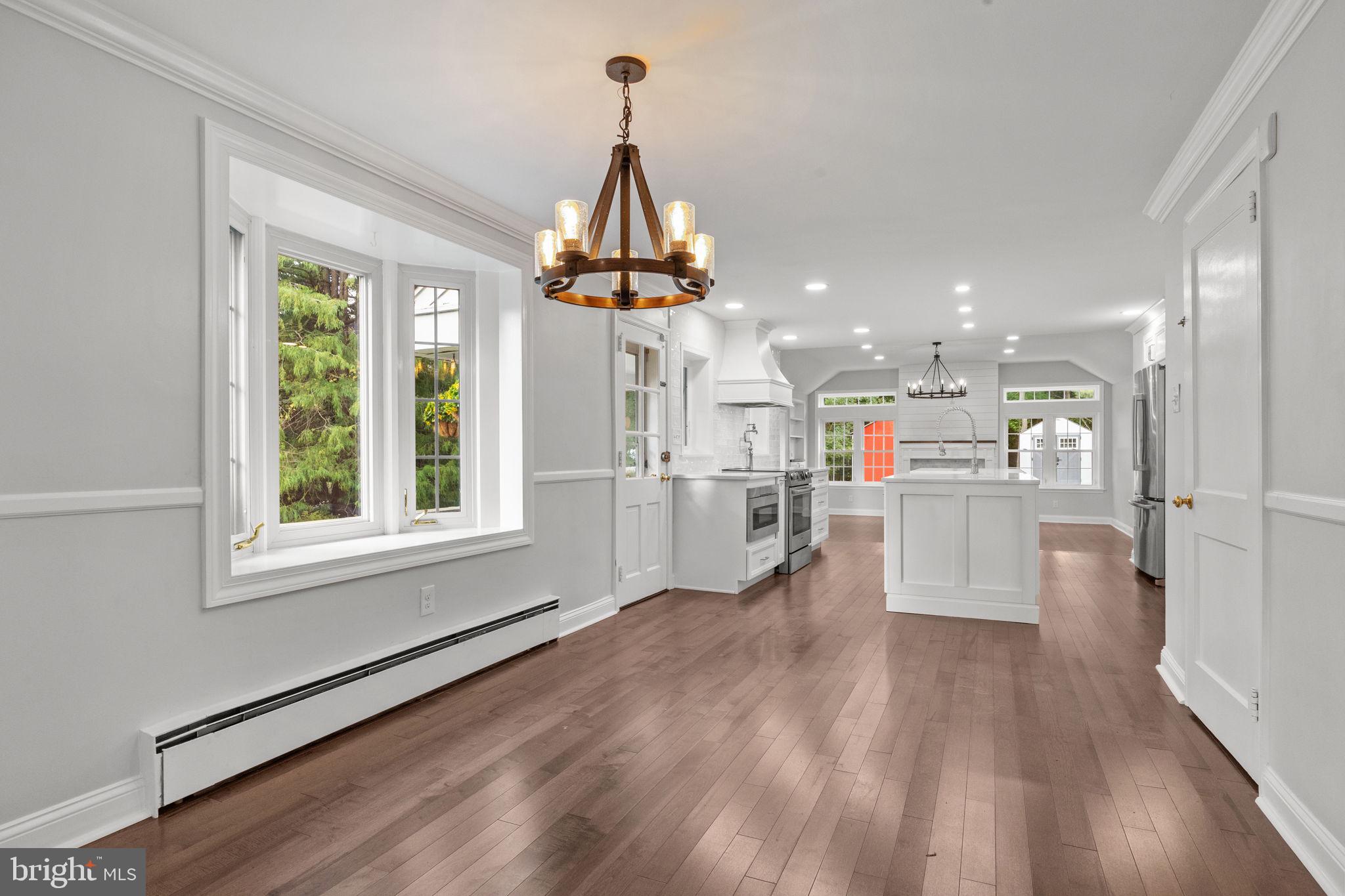 1434 Holcomb Road Huntingdon Valley, PA 19006 - Photo 13 of 49 a view of a kitchen and dining room with wooden floor