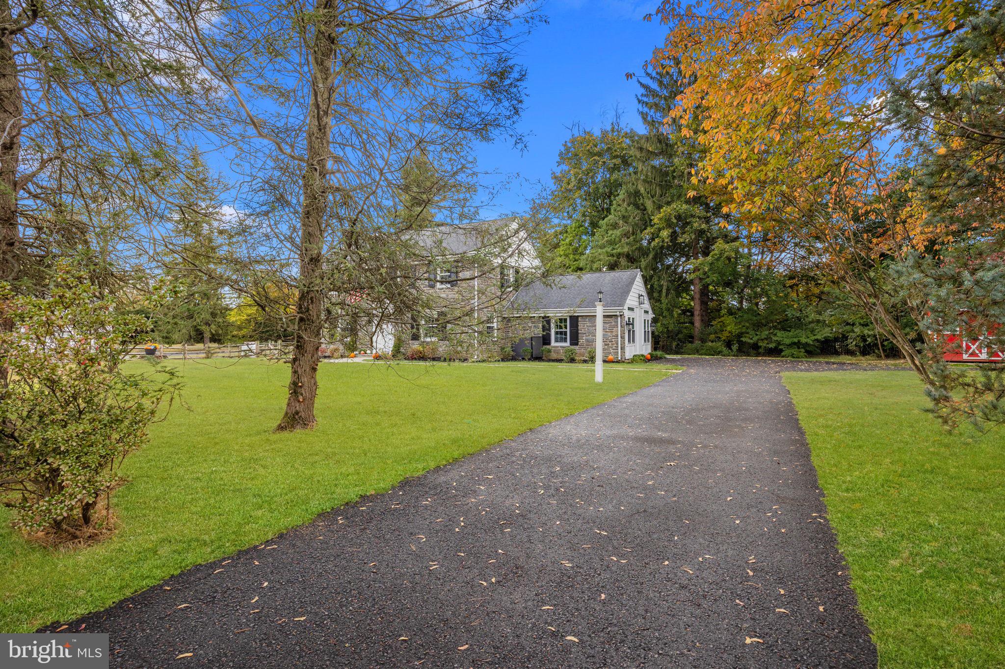 1434 Holcomb Road Huntingdon Valley, PA 19006 - Photo 2 of 49 a view of house with garden and trees