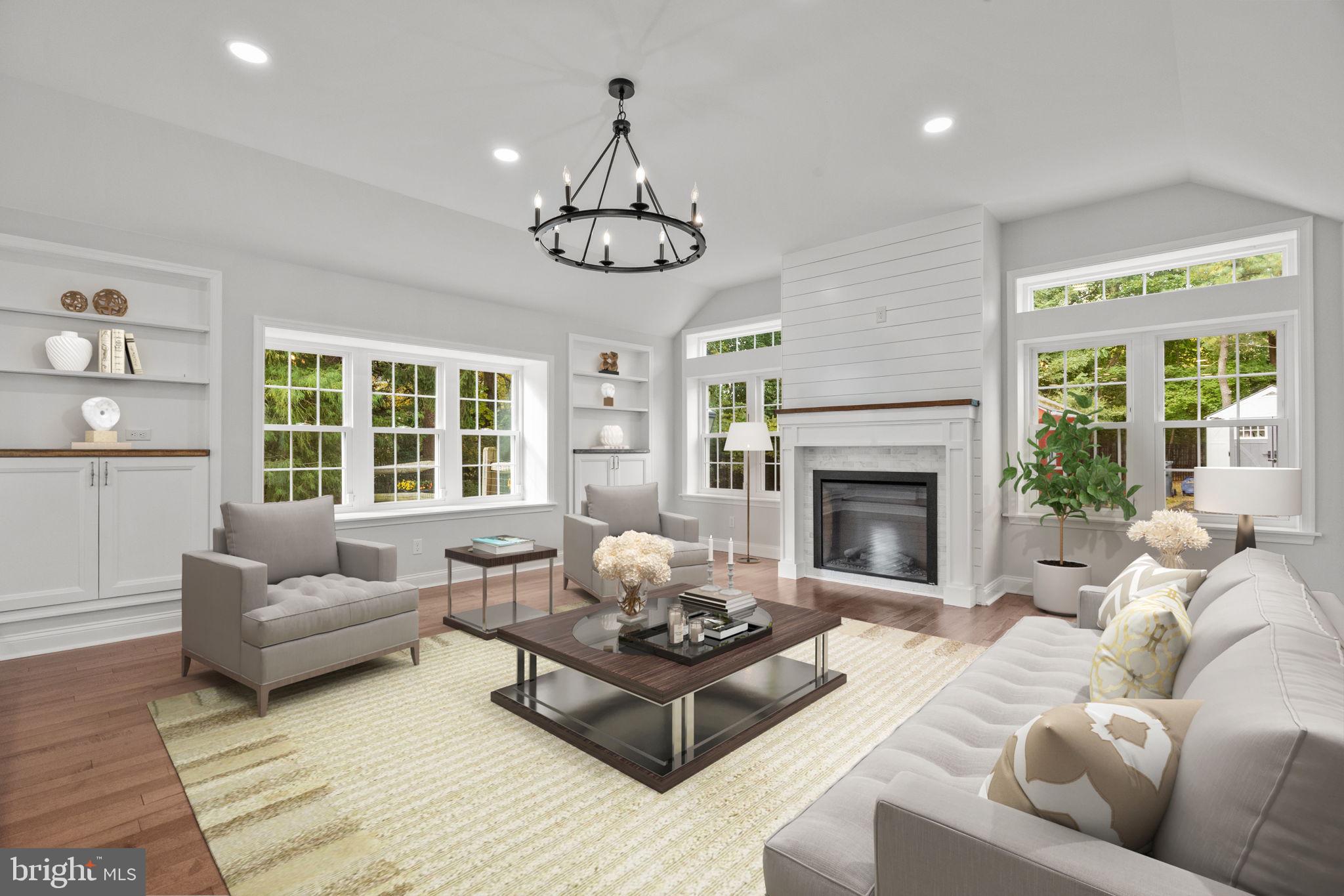 1434 Holcomb Road Huntingdon Valley, PA 19006 - Photo 21 of 49 a living room with furniture chandelier and a fireplace