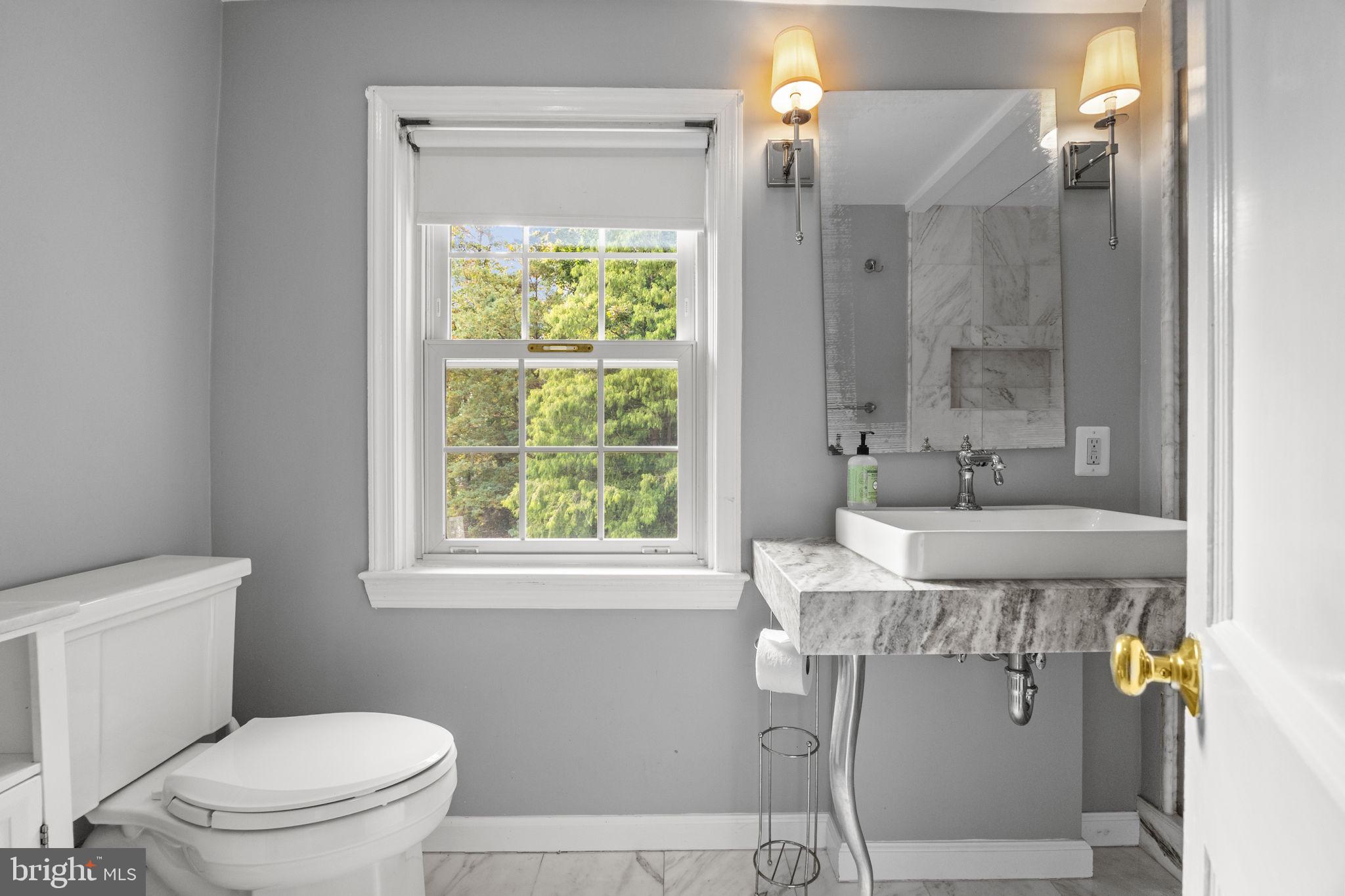1434 Holcomb Road Huntingdon Valley, PA 19006 - Photo 34 of 49 a bathroom with a granite countertop sink a toilet and shower