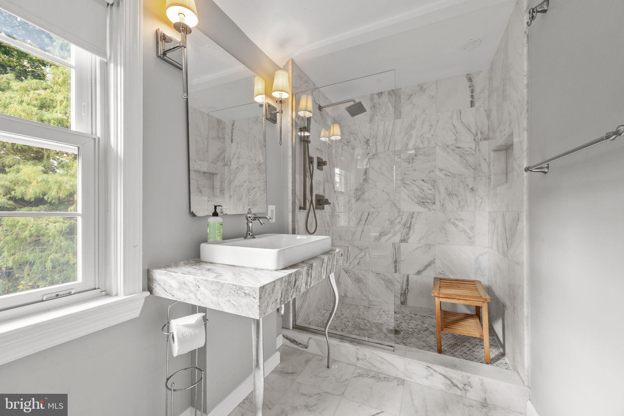 1434 Holcomb Road Huntingdon Valley, PA 19006 - Photo 35 of 49 a bathroom with a granite countertop sink a mirror and a shower