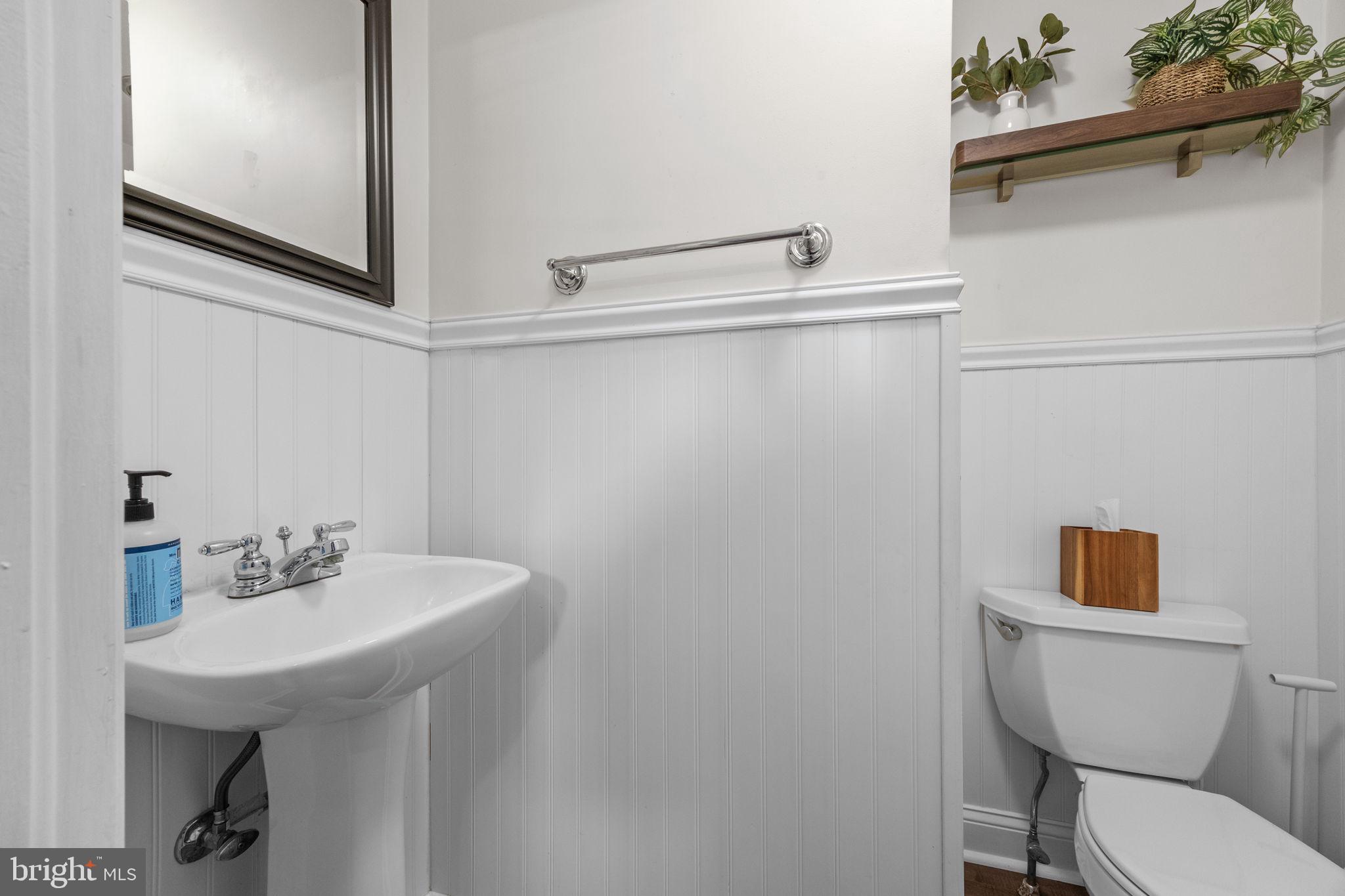 1434 Holcomb Road Huntingdon Valley, PA 19006 - Photo 40 of 49 a bathroom with a toilet a sink and mirror