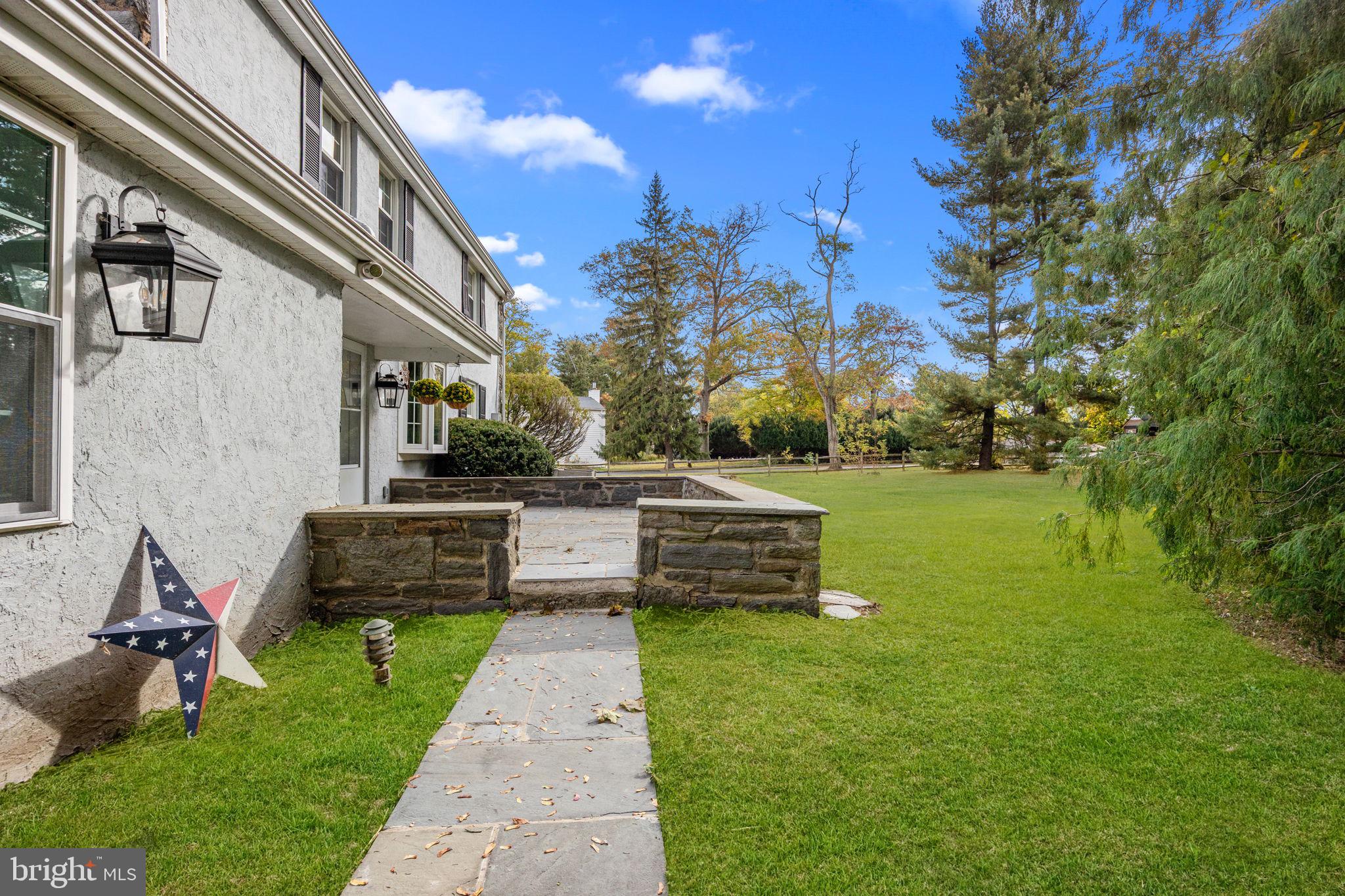 1434 Holcomb Road Huntingdon Valley, PA 19006 - Photo 44 of 49 a view of a garden with a bench