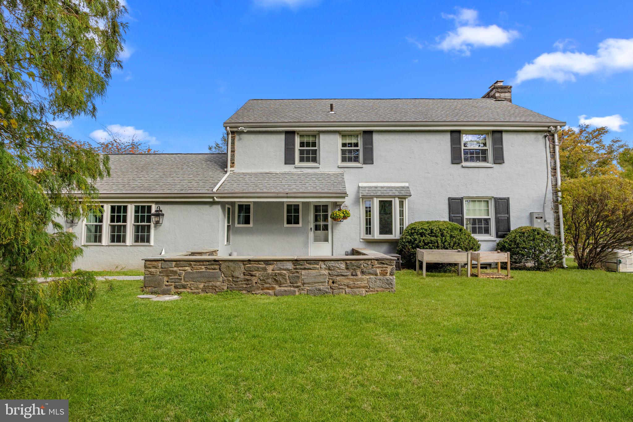 1434 Holcomb Road Huntingdon Valley, PA 19006 - Photo 49 of 49 a front view of a house with a garden