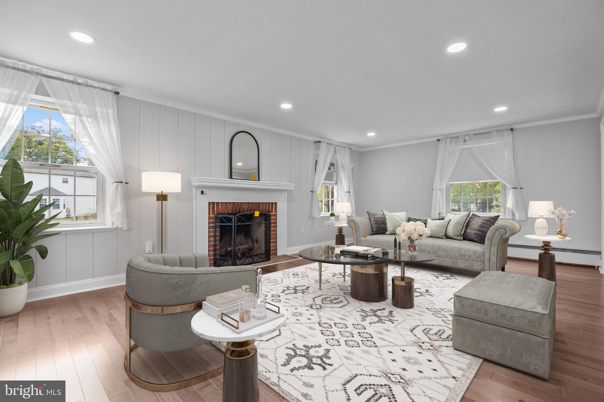 1434 Holcomb Road Huntingdon Valley, PA 19006 - Photo 8 of 49 a living room with furniture a fireplace and a large window