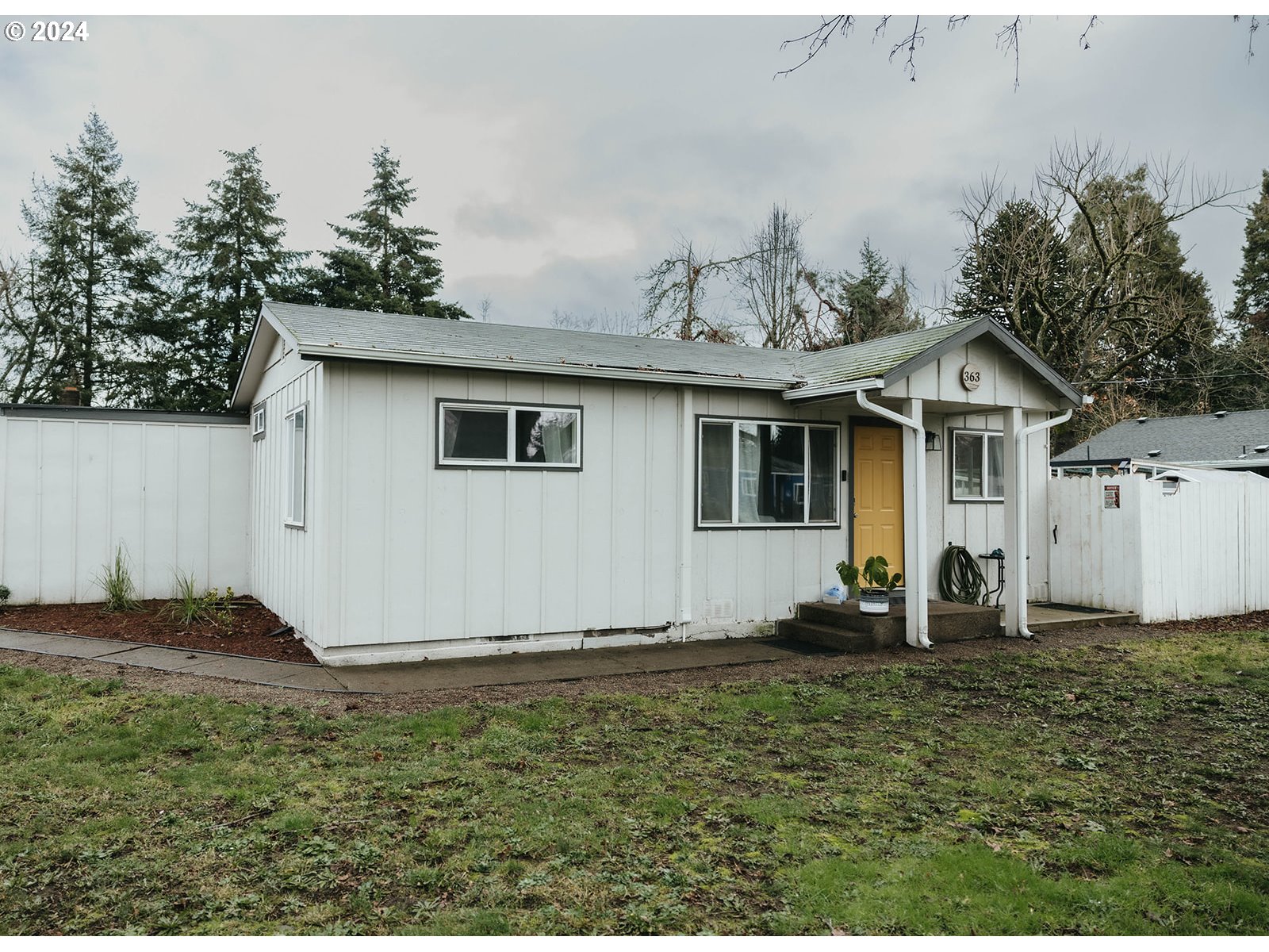 363 57th Street Springfield, OR 97478 - Photo 1 of 19 a front view of a house with a yard