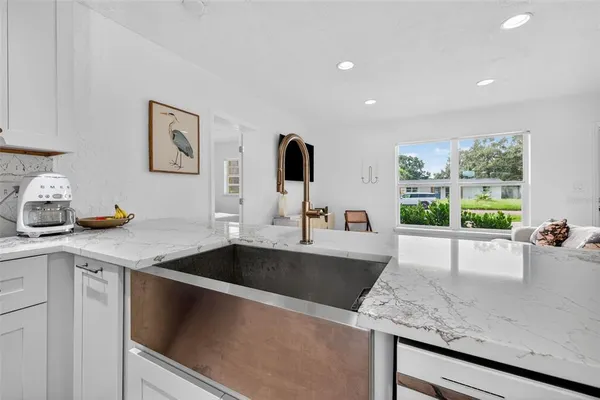 a kitchen with a sink and a refrigerator