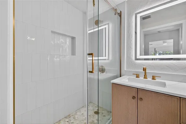 a bathroom with a sink and a mirror