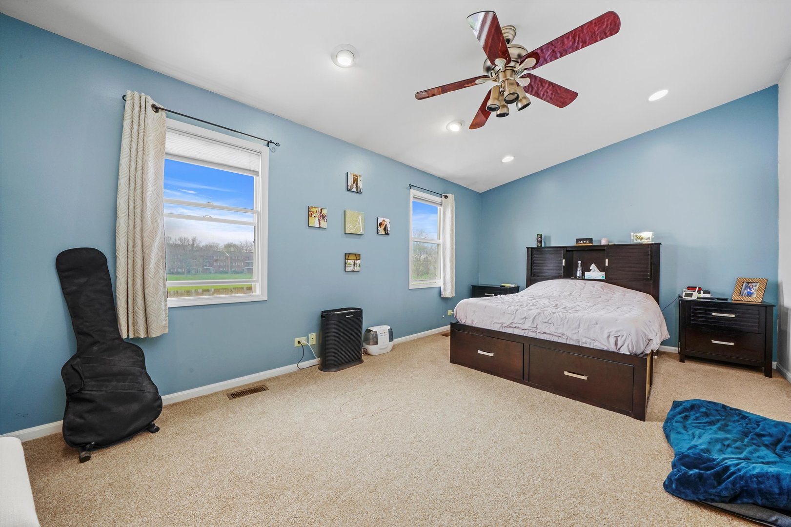 709 Daybreak Lane Carol Stream, IL 60188 - Photo 11 of 30 a bedroom with a bed and a chandelier